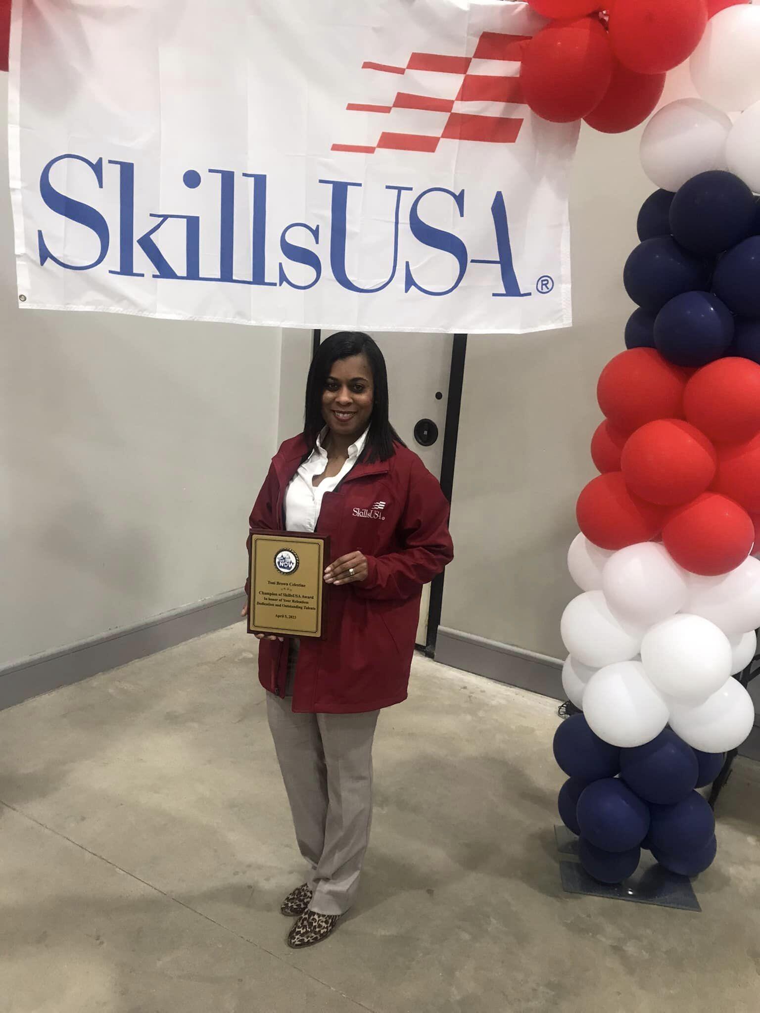 SLCC Toni Celestine holding her Skills USA award