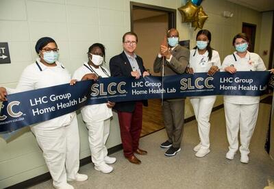 From left: PN students Clarissa Lewis and Shalonda Evans; Brady Broussard with LHC Group; Dr. Vincent June, SLCC Chancellor; and PN students Kadeisha Mitchell and Mia Lancon.
